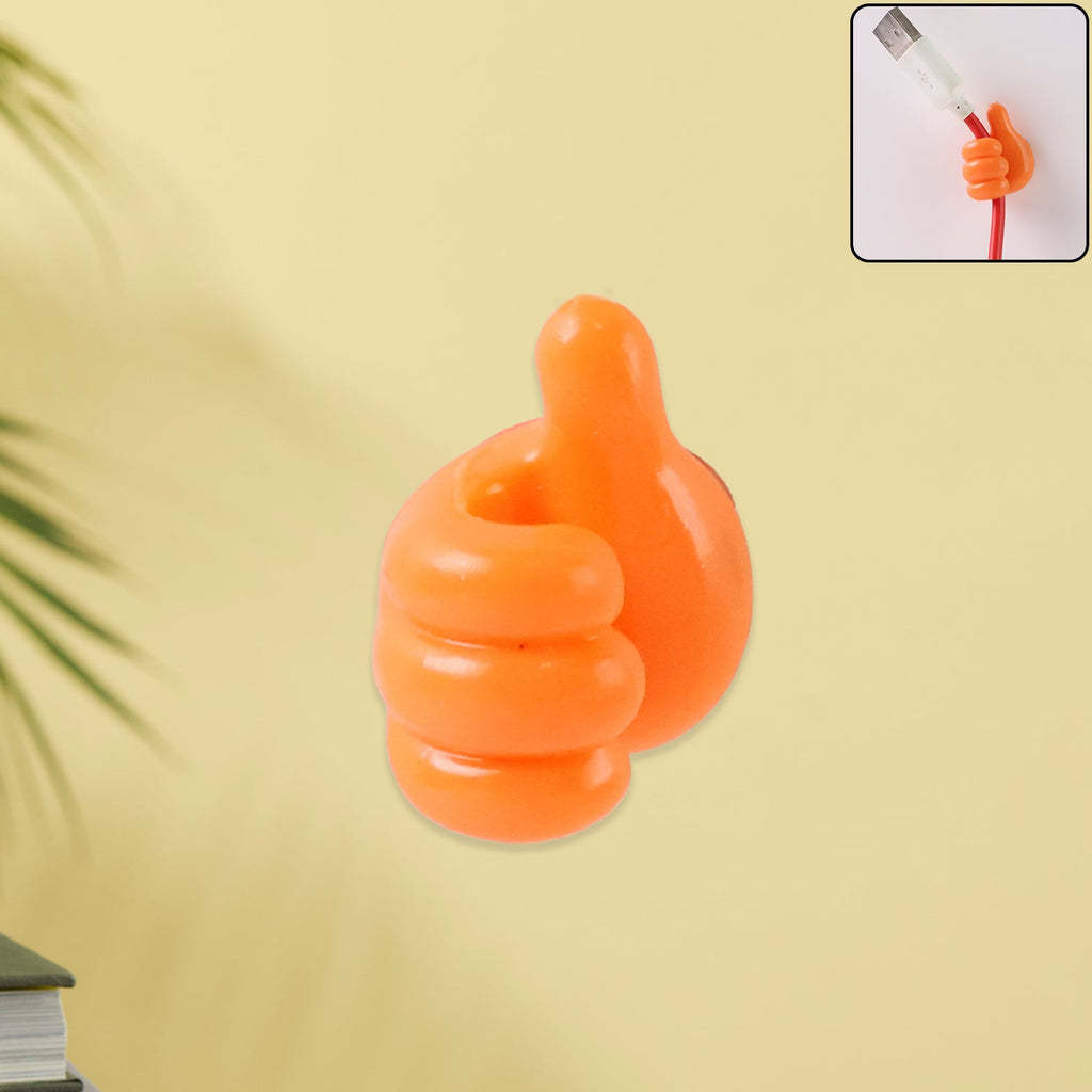 Orange hand-shaped silicone wall clip holding charging cables securely