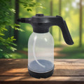 Electric garden sprayer, 2L capacity, shown in use for plant watering.