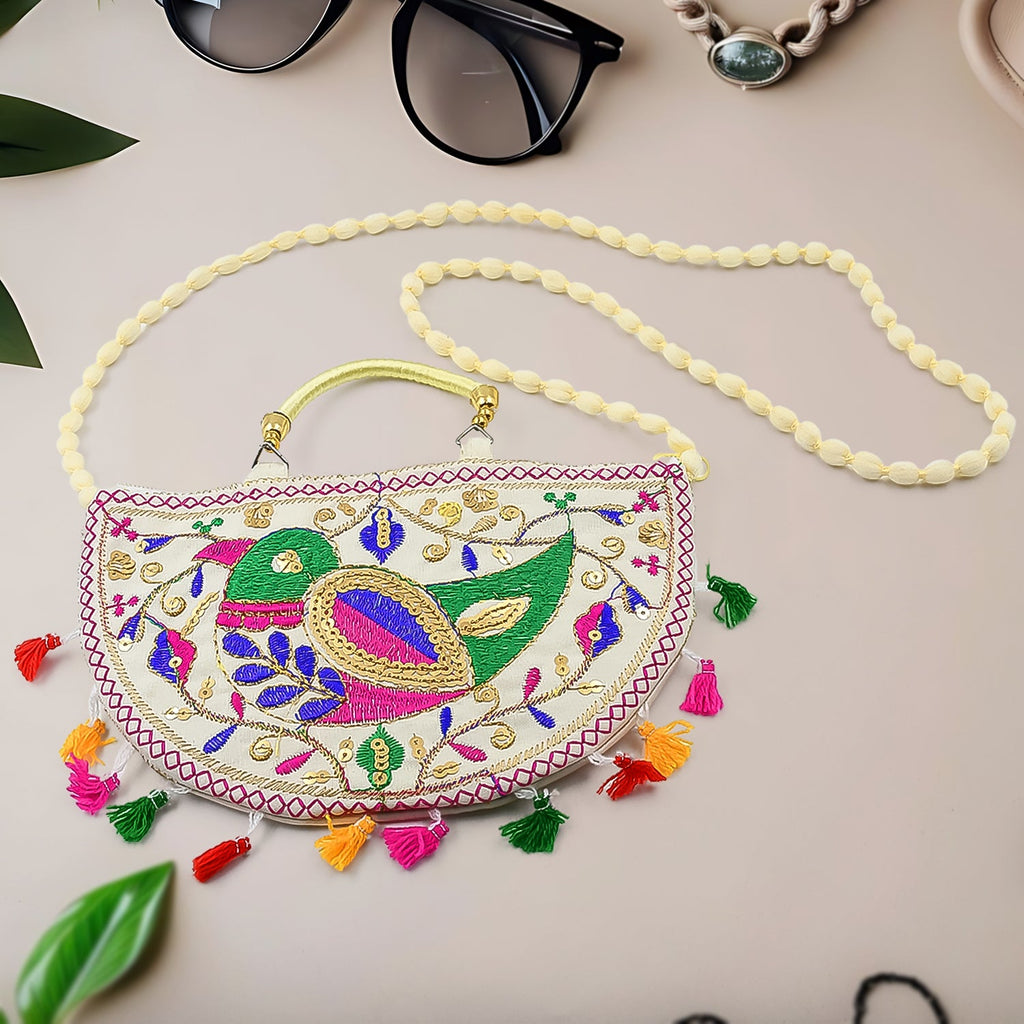 Vibrant Rajasthani Handbag with intricate multi-color embroidery on a light background.