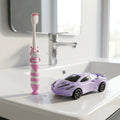 Kids toothbrush with cartoon car design and soft bristles for gentle cleaning