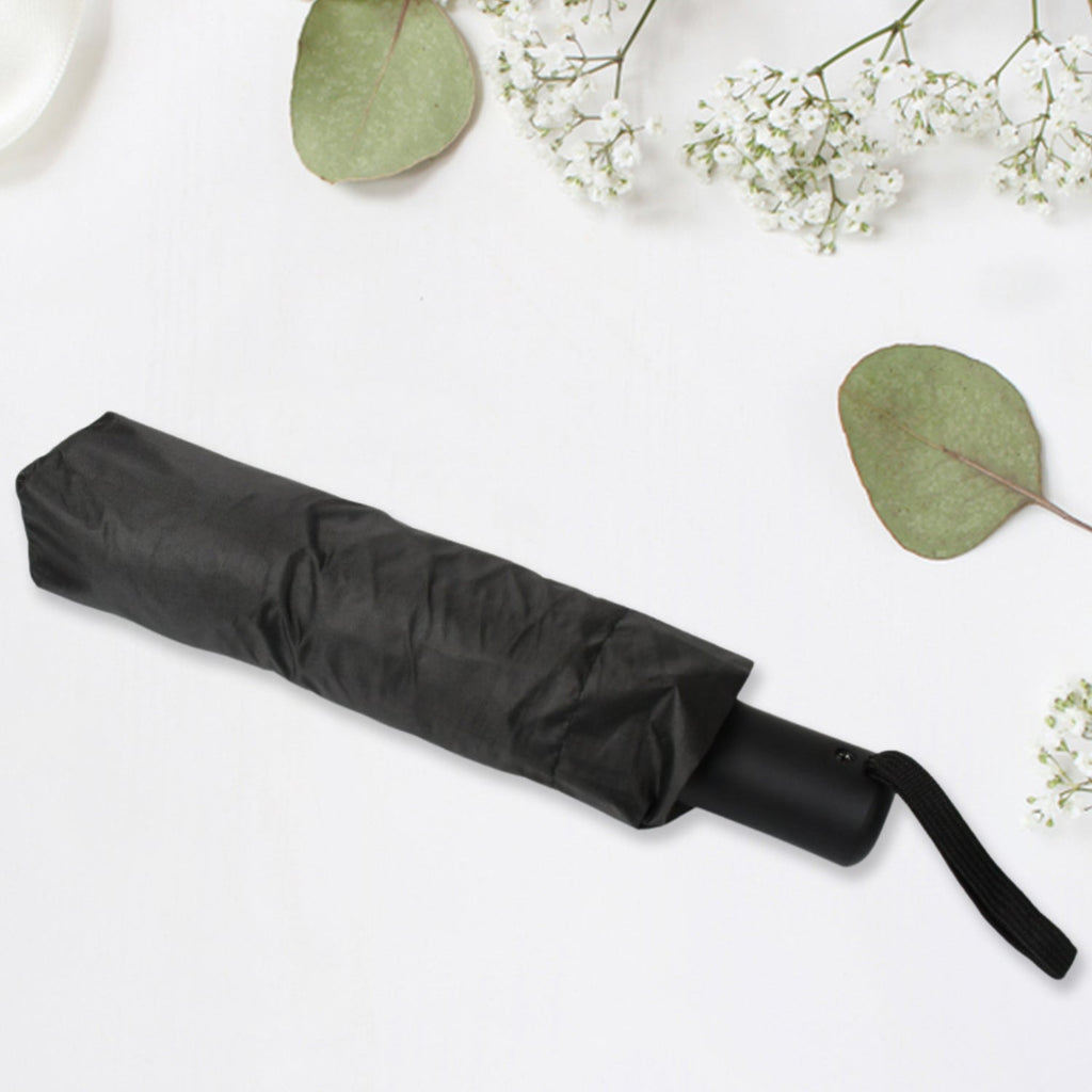Compact umbrella easily sliding into a backpack pocket, highlighting its portability.