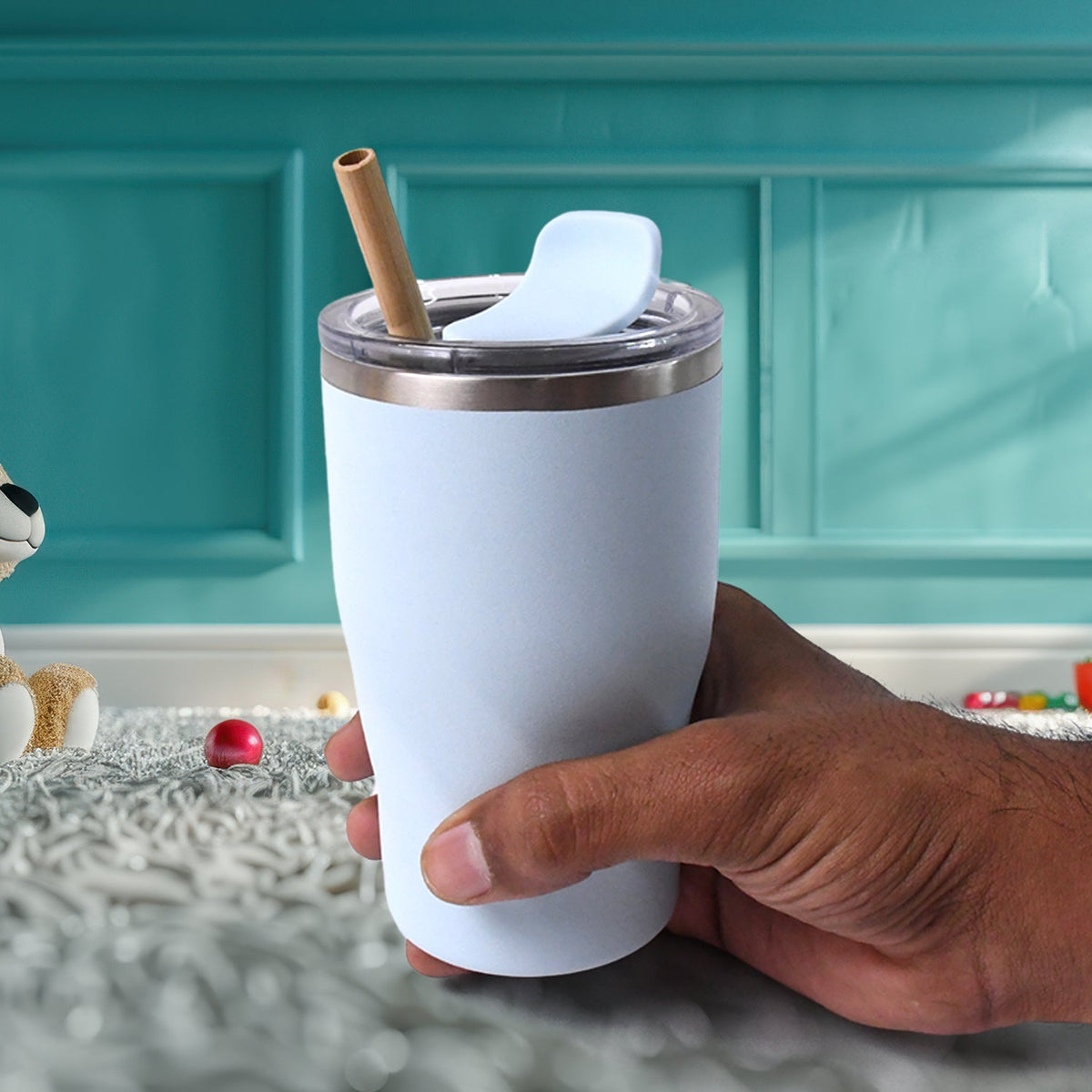 Stainless steel insulated coffee mug featuring a wooden straw for hot and cold drinks