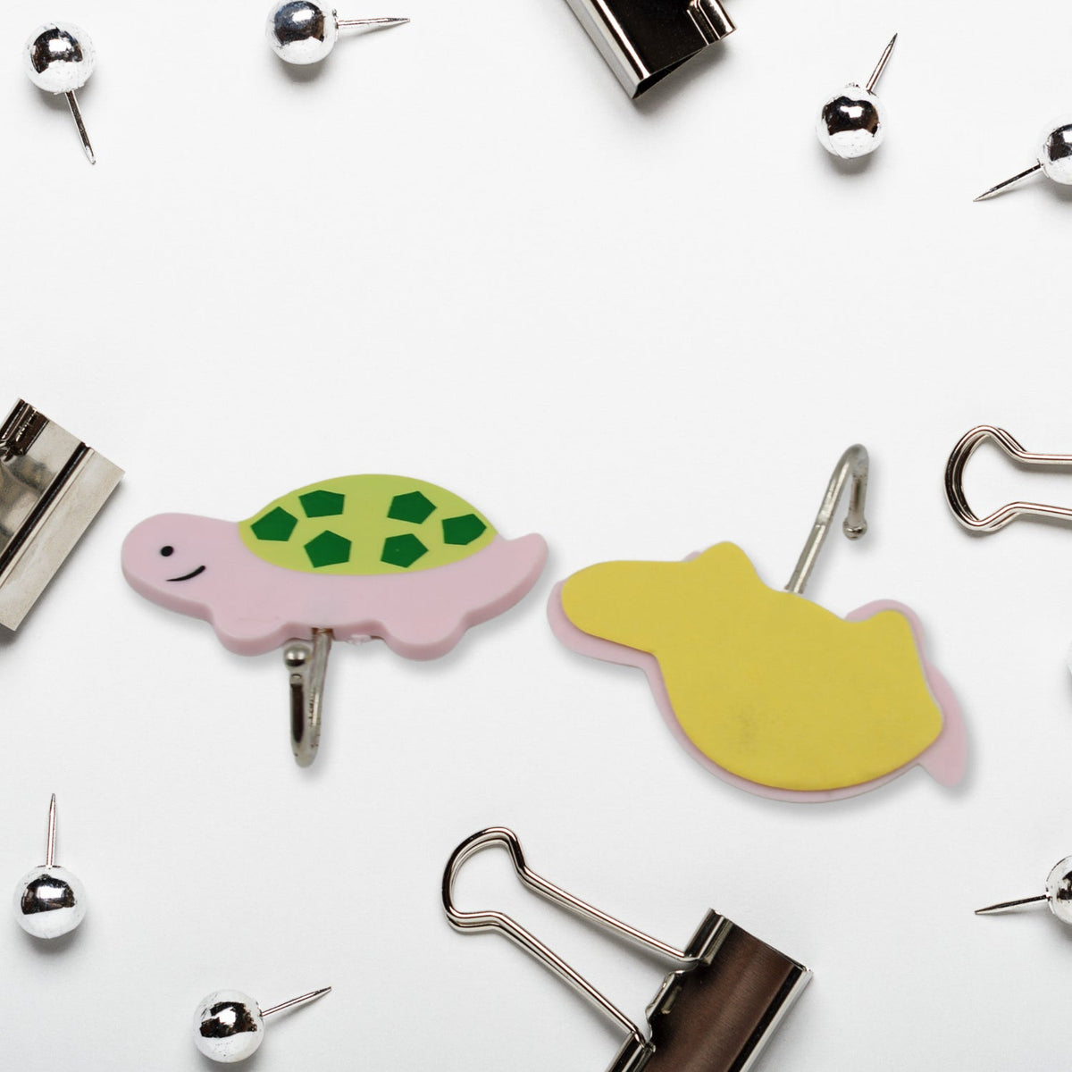 Multiple cartoon animal self-adhesive wall hooks displayed neatly against a clean white background.
