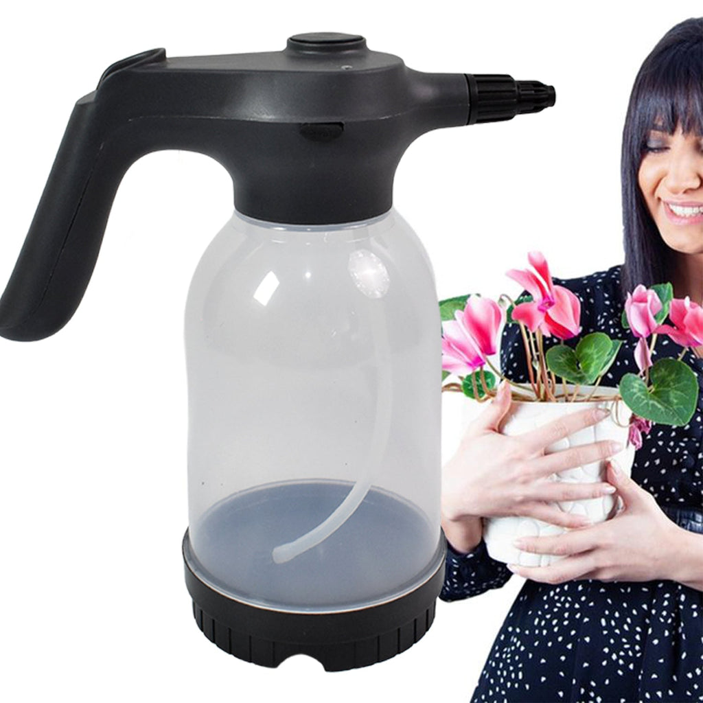 Portable electric sprayer bottle demonstrating fine mist spray for plants.