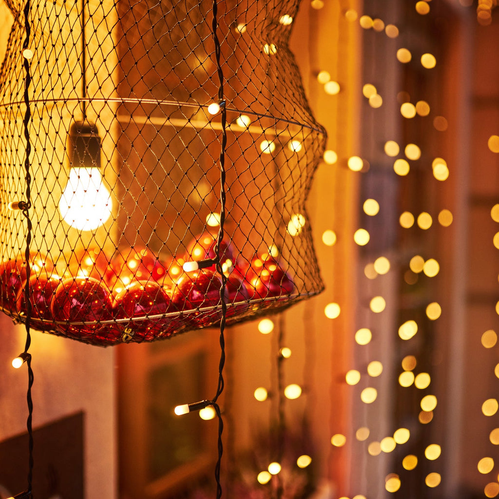 Long 9-meter multi-color LED string lights adding sparkle to a home setting.