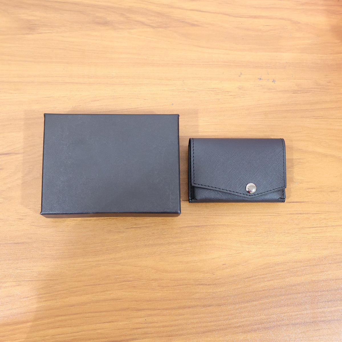 Secure snap closure compact multi-card wallet with sleek textured finish