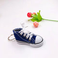 Close-up of a vibrant red running shoe keychain design.