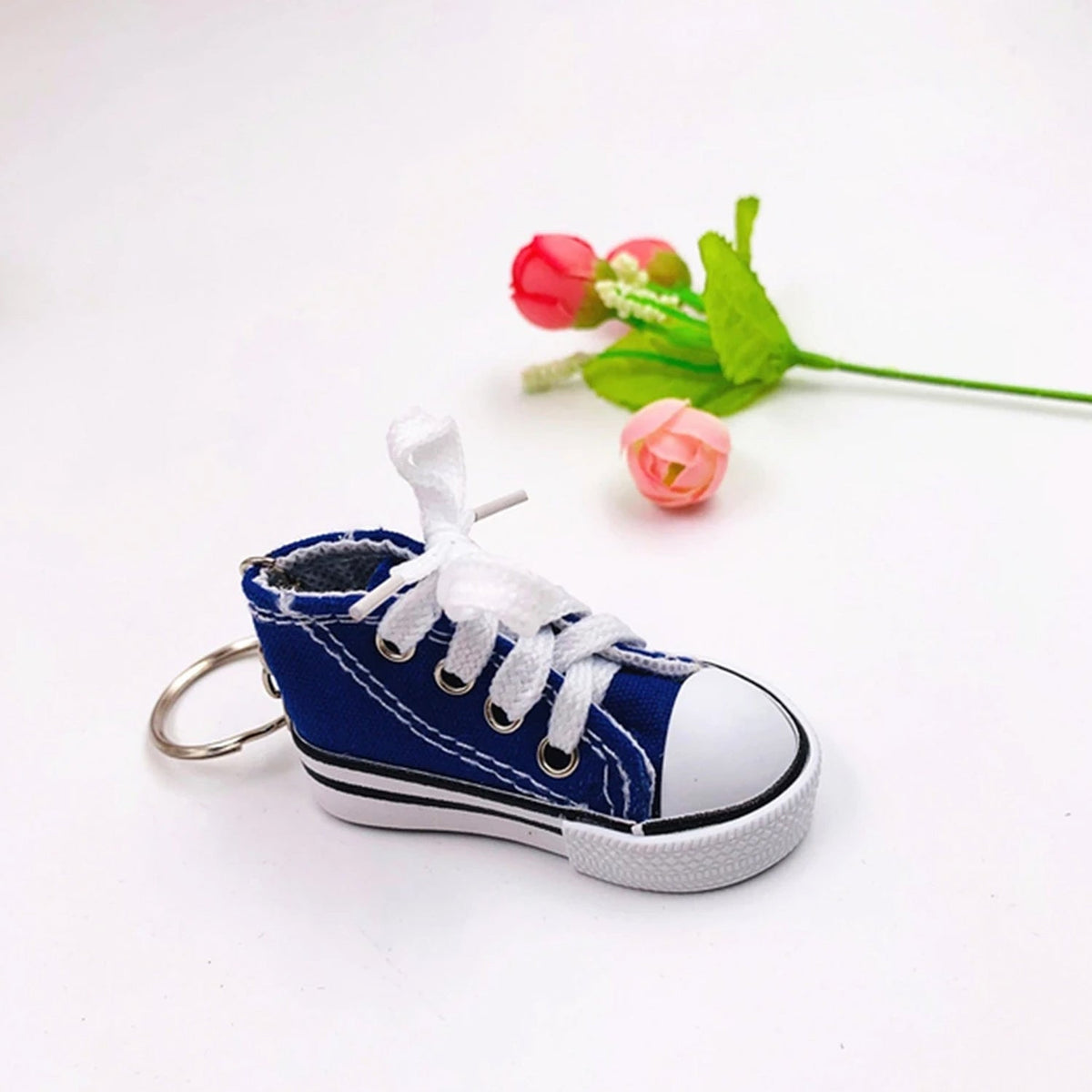 Close-up of a vibrant red running shoe keychain design.