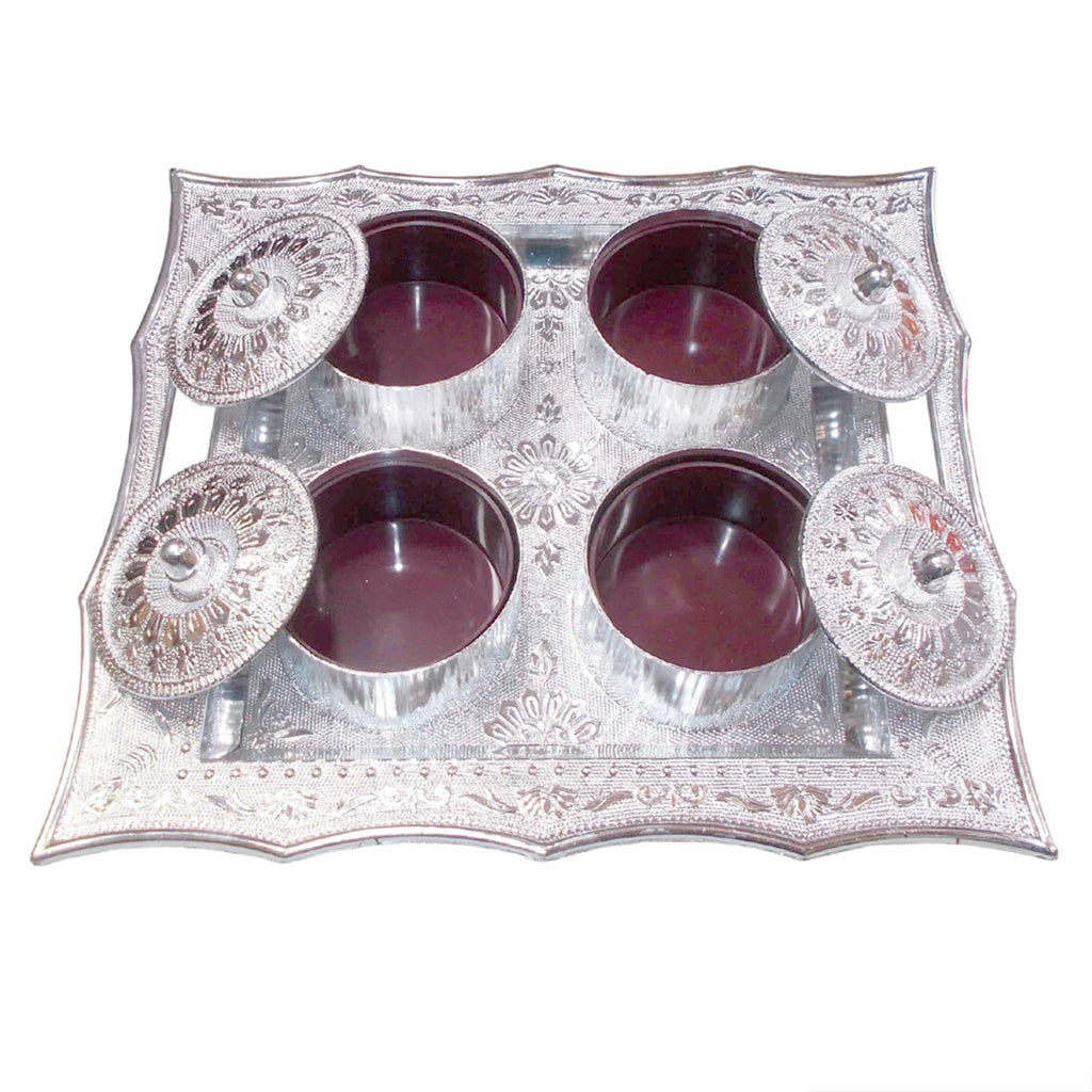 Traditional mukhvas dani with secure airtight lids on a dark background.
