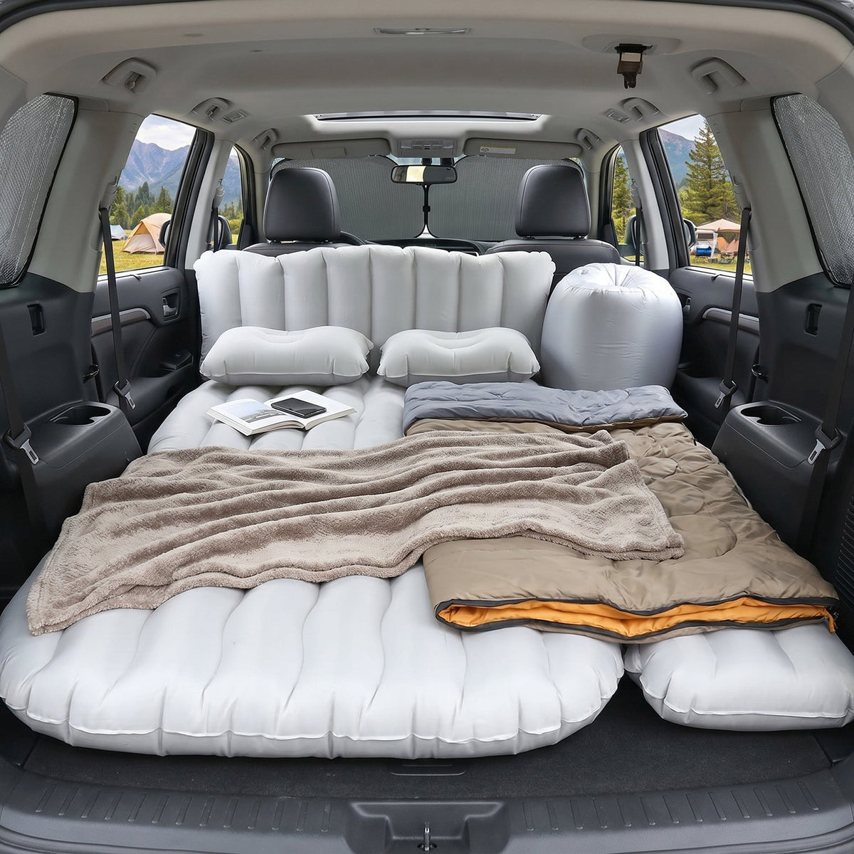 Inflatable car mattress laid out inside vehicle for rest