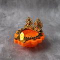 Water Sensor LED Diya with golden Laxmi Ganesh idols illuminating gently